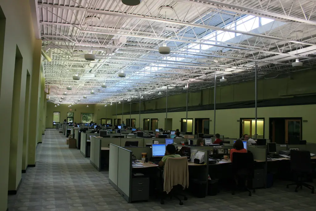 Open-plan office workspace with desks and computers
